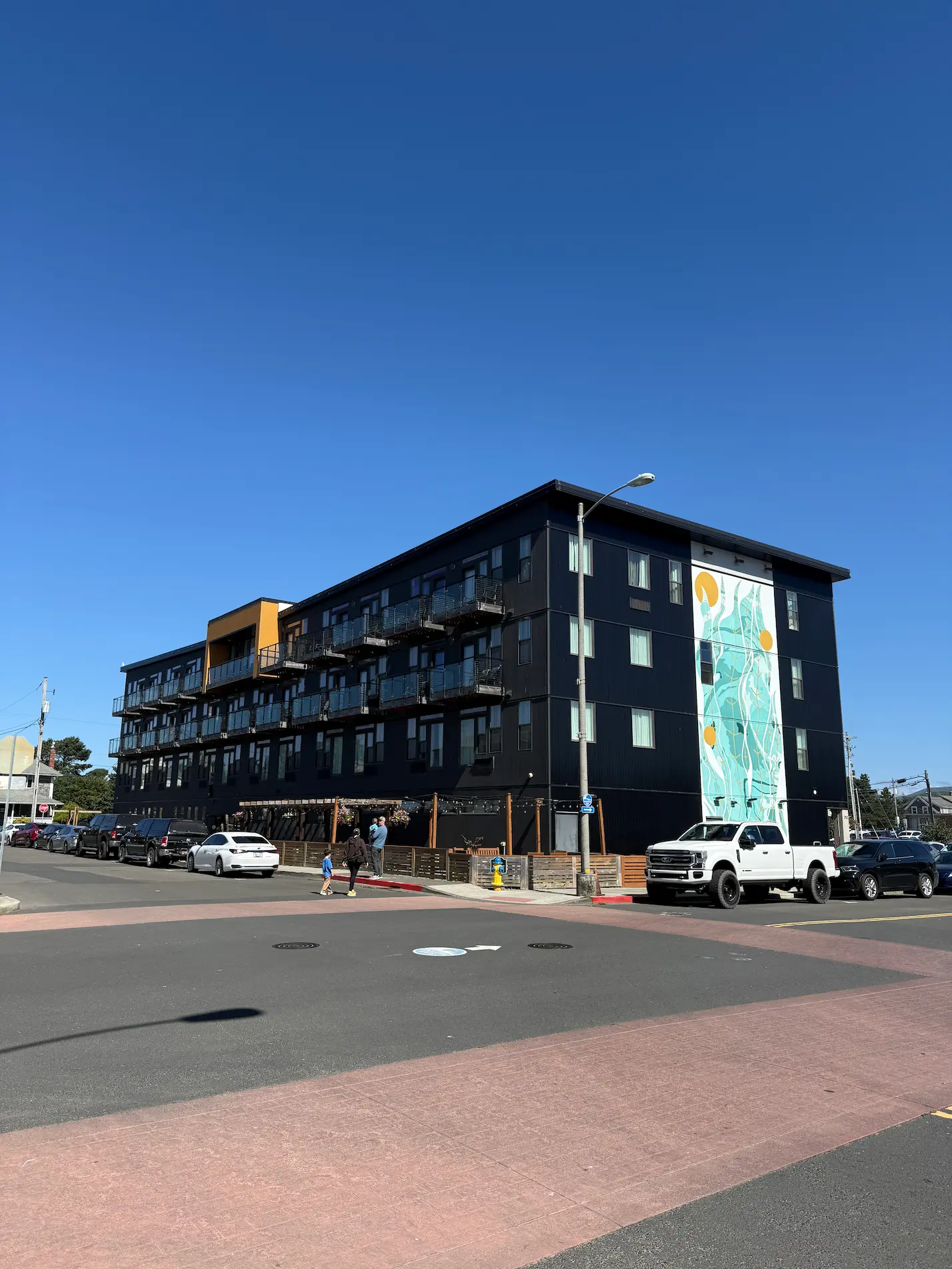 A large building featuring a prominent sign displayed on its facade.