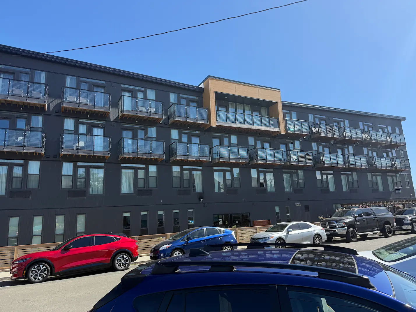 Modern, dark-gray apartment building