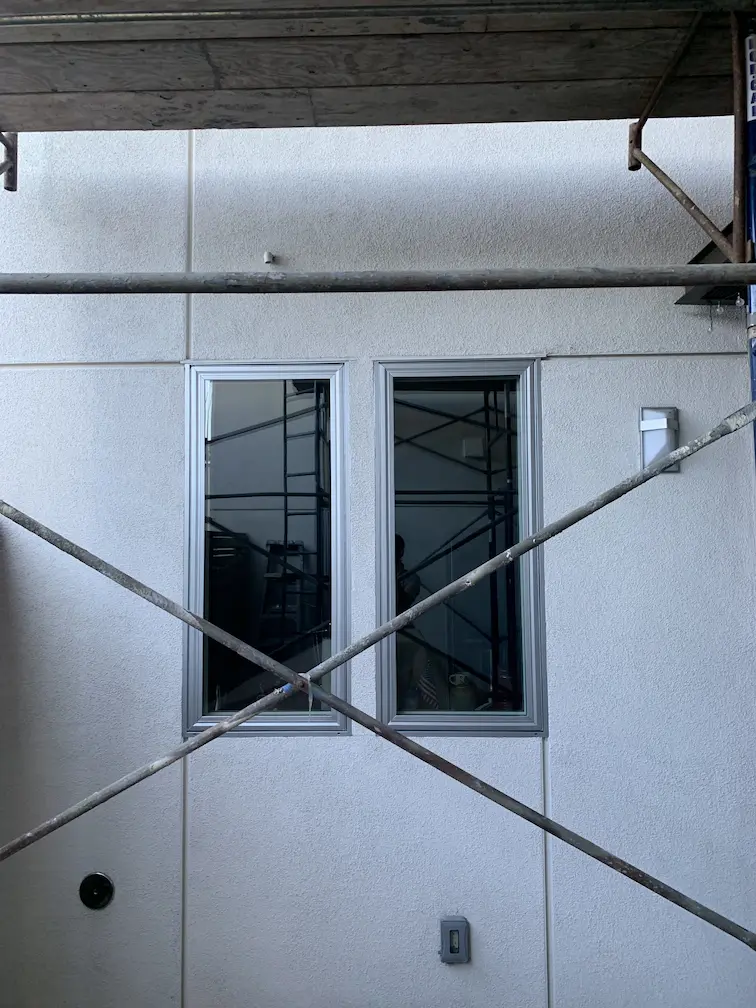 narrow windows set in a white wall 