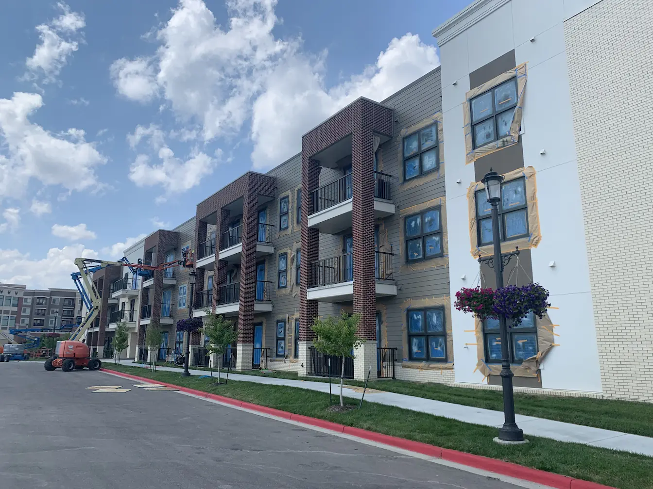 multi-story apartment building with masked windows