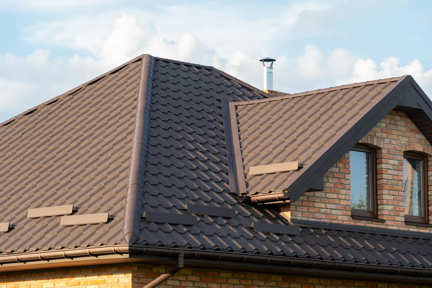  pitched brown metal tile roof