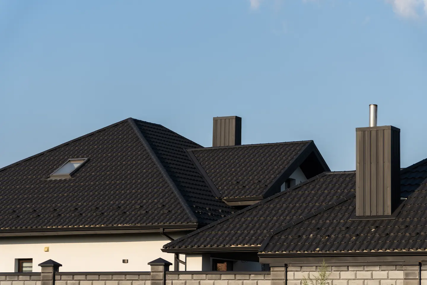 white house facade and brick fence